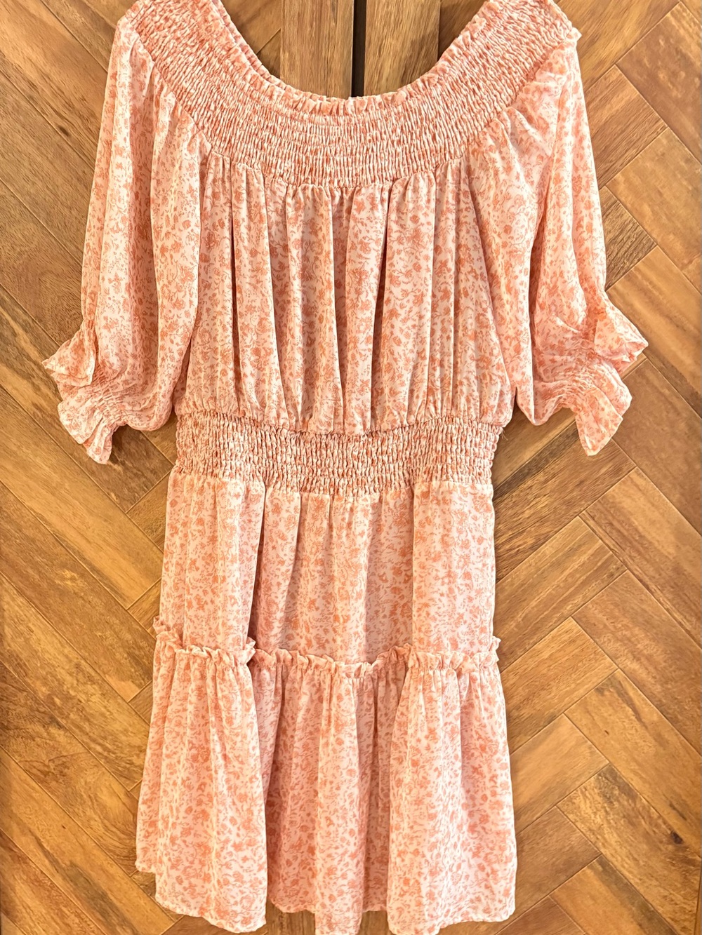 Bohme Smocked Off-Shoulder Floral Mini Dress in Peach